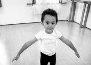 A boy is dancing ballet